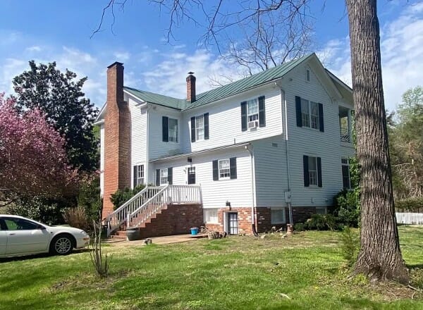 Old home with new green metal roof