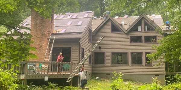 Roof installation on home in the woods