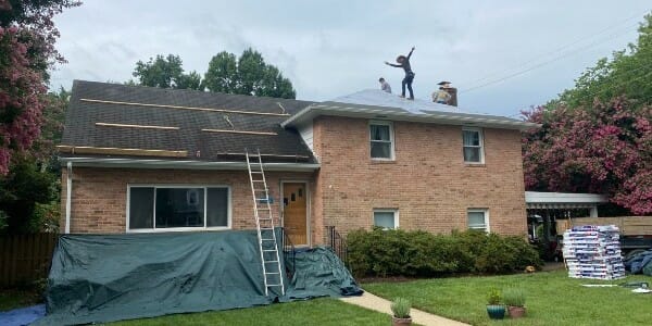 K&J employees repairing a roof