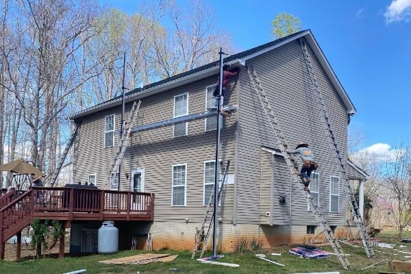 New gutters being installed on home